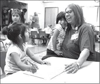 With more than 30 years of experience, Wallace looks forward to continuing to work with future generations of children in the Head Start setting. From left: Xoie Jones, Serenity Wisdom and Hazel Wallace work together during Head Start class.