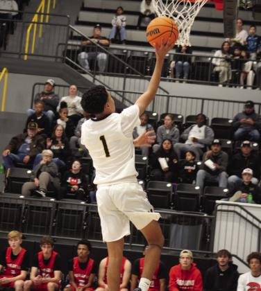 Sammy Duran goes for a layup. Photo by Summer Bryant