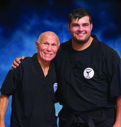 Courtesy photo Chickasaw warrior Ezra Johnson, right, and Bill “Superfoot” Wallace. .