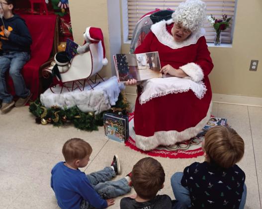 Santa and Mrs. Claus visit the library