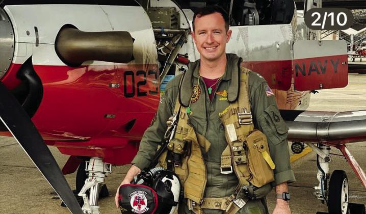 Lt. Cameron Baxter in front of his training plane, the T-6B Texan II. In 2.5 years, he racked up more than 1,000 flight hours training other pilots. Courtesy photo