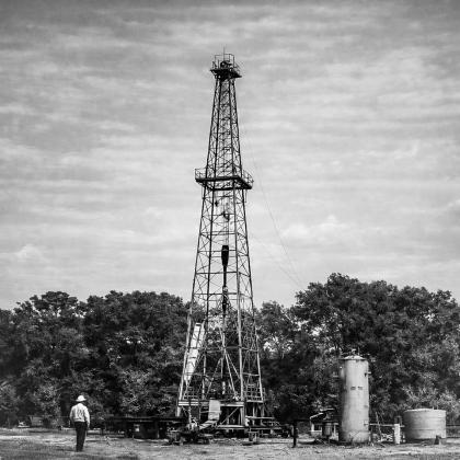 Wendyl Watts inspecting the first oil well in the new Pure Oil Company oil field, the Number 1, Little-100 well. Courtesy photo