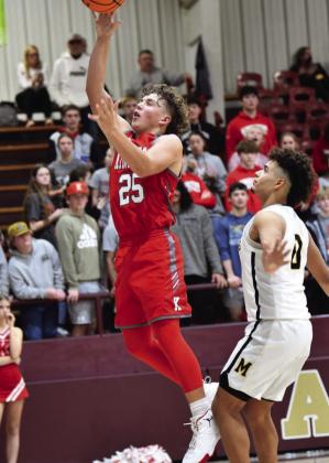 Parks Ratzliff goes for a jump shot during the Kingston v Madill game to start off the Wampus Cat Classic tournament. Crockett Uber