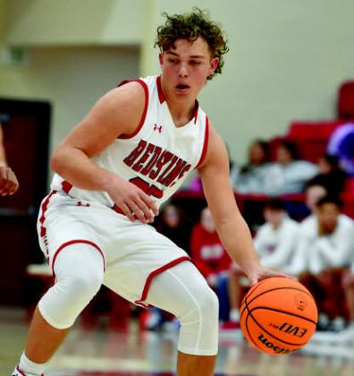 Parks Ratzlaff dribbles down the court during the Redskins v Comets game. Crockett Uber