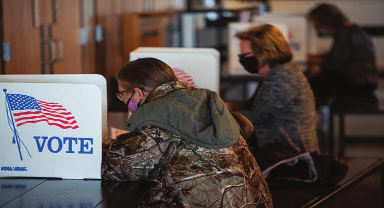 Vicky Avery, front, voted in one of Oklahoma’s most Republican districts on Nov. 3 at Harrah Church. Whitney Bryen • Oklahoma Watch