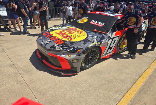 NASCAR holds a pre-race event that includes pushing the cars out to the starting line. Charles White • The Madill Record