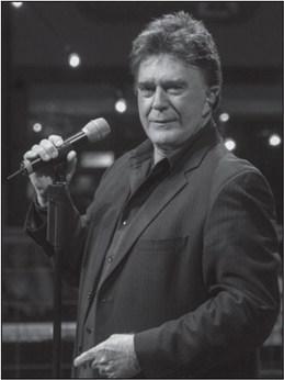 Country recording artist T.G. Sheppard performed at The Dog House at Ole Red. He entertained guests by telling the backstories behind his hits singles. Courtesy of Wikicommons