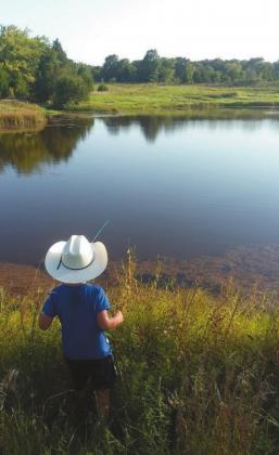 Gunnison Rockwell (age 5) fishing for bass in his great grandpa’s farm pond in Okfuskee County. Courtesy photo