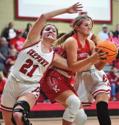 Ethel Stewart fights for control of the ball during the Kingston and Sulphur game. Crockett Uber