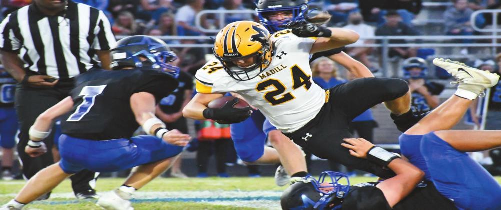 Madill junior running back Brandon Stephens, #24, runs through a line of Dickson Comets during their winning game on September 25. Jennifer Rushing