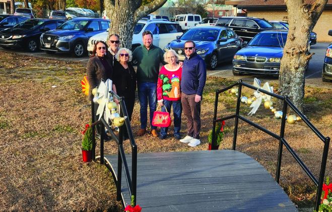 The bridge was dedicated to Herschel Beard for his tireless dedication. The Beard family, pictured right, stands by the bridge. Photos by Andrea Dunlap
