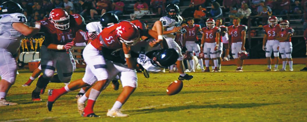 Kingston’s Jesse Rose (#55) sacks Little Axe quarterback Hunter Henderson (#4) and forces a fumble for his second strip sack of the night, which Brycen Ellisor (#45) would recover. Linda Holmes