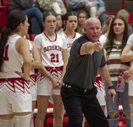 Pictured left: Redskin Lander Burkhalter clutches the ball during the home game with the Madill Wildcats. Pictured middle: Kingston Lady Redskin Joley Heydon shoots the ball in the game with Madill. Pictured right: Lady Redskins basketball head coach Chad Rumer makes a point to his team during last Friday’s home game with the Madill Lady Wildcats Matt Swearengin