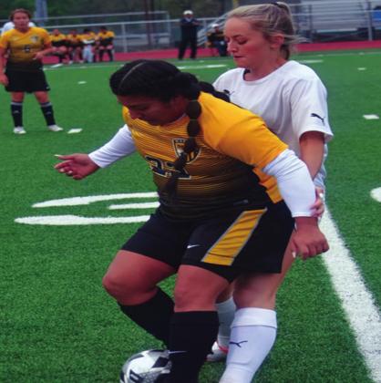 Ana Veras defends the ball during a Madill Girls Soccer game. They won both games on April 13 and April 16, 2021 against the Cushing Lady Tigers and Bristow Lady Pirates. Summer Bryant • The Madill Record