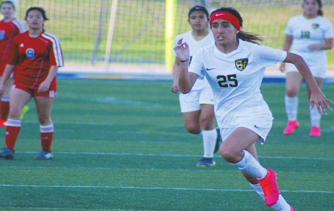 Glenn Price • The Madill Record Giselle Bautista (25) runs offense against the Durant Lions on March 10. Even though they fought hard, the loss brought the Lady “cats record 1-2.