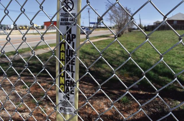 An Oklahoma Natural Gas pipeline sign is shown in Oklahoma City on Tuesday, March 12, 2024. Paul Monies • Oklahoma Watch