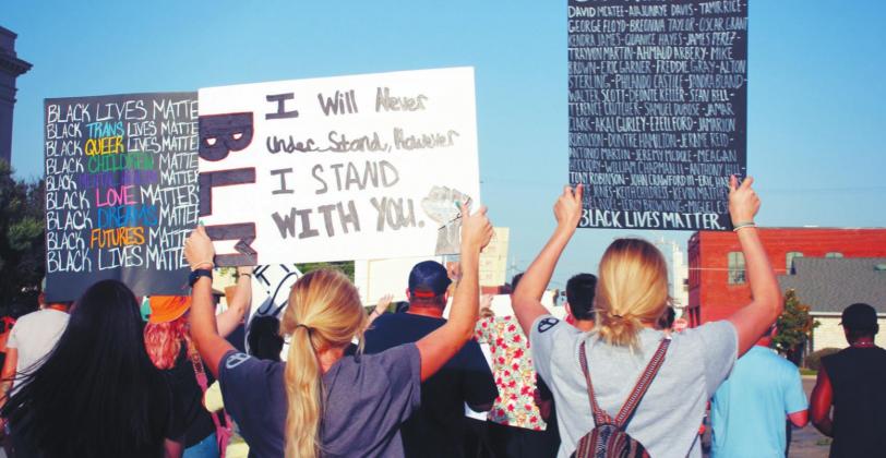 A group of protestors hold signs and chant at a Black Lives Matter march at Durant City Hall on June 9. The peaceful protest drew an estimated crowd of 700 people. Summer Bryant • The Madill Record