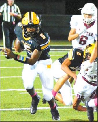 Tony McSwain • Courtesy Photo Senior Jarod Fields #5, escapes the onslaught of Tuttle Tigers.