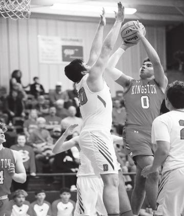 Crockett Uber • For The Madill Record Kingston’s Brady Brister (0) takes a shot over a Durant Lions player during the Wampus Cat Classic Championship game on Jan. 25.