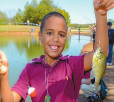 A young boy shows off his catch at South Lake Park. Courtesy Photo