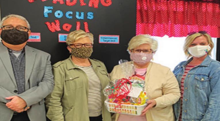 Kim Scott (second from right) is Teacher fo the Year for Madill Elementary School. Larry Case, Kristi Birdson and Jamea Gilbert were all on hand to congratulate her. Courtesy photo