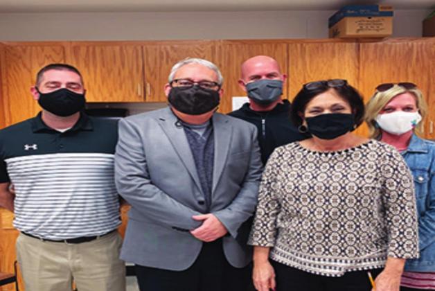 The Madill High School Teacher of the Year is Bobbie J. Whitten (front right). Jason Ward, Larry Case, Coach Chad Speer and Jamea Gilbert congratulated her. Courtesy photo