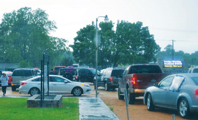 Members of the Madill High School Class of 2020 gather in the parking lot of Oakview Baptist Church for a parade in their honor May 15. Both the students participating in the parade and those helping organize it had to contend with heavy rain that evening. Matt Caban • The Madill Record