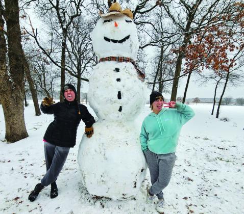 The Texoma area was hit by a snow storm on January 9. Some areas received up to seven inches of snow. Melissa Reno, with the help of others, built a 7' 6' tall snowman. Photos courtesy of Melissa Reno