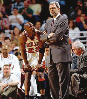 Michael Jordan (23) and Chicago Bulls head coach Phil Jackson look on from the sideline circa 1998 at the United Center in Chicago, Ill. The pair are featured prominently in the new ESPN/ Netflix documentary, “The Last Dance” about the final season of the Bulls’ NBA dynasty. Barry Goosage • NBAE via Getty Images