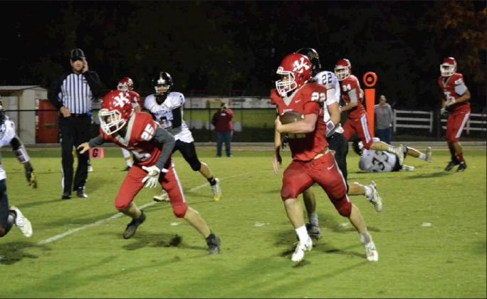 Tony McSwain • The Madill Record Kingston’s offense on the move in a game against Marietta in 2018. The team finished with a record of 11-2 last season and made it to the third round of the Class 2A playoffs.