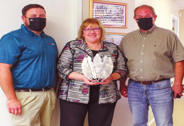 Leigh Ann Brooks of Texoma Wealth Management, middle, was awarded the Chahtapreneuer Award from the Choctaw Nation Small Business Development. Courtesy photo