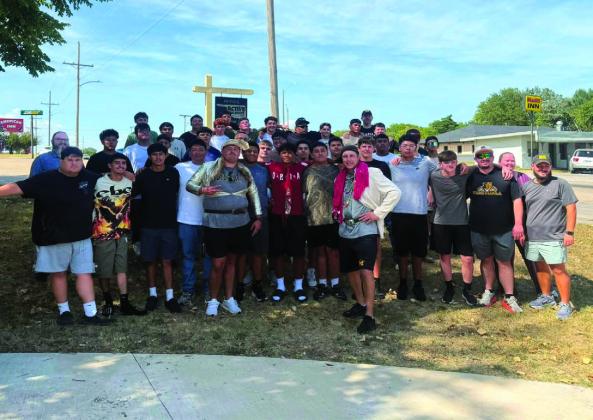 The MHS football team assisted in rearranging the Hope for Marshall County store. Courtesy photo