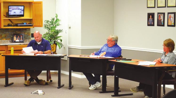 Public Schools superintendent Larry Case (center) speaks during the May 11 MPS Board of Education meeting at the MPS Administrative Center Conference Room. At left is Mark Glenn, board member, and at right is Carol Combs, MPS treasurer. Matt Caban • The Madill Record Madill