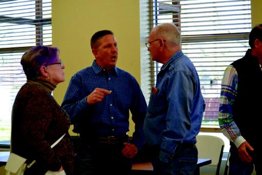 Josh Brecheen talks with his constituents before and after the town hall meeting on March 17. Leslie Mowles • The Madill Record