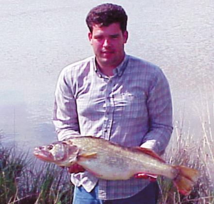 Kerry Carter caught a record-breaking Walleye on May 8, 2004. The fish was 12 lbs. and 13 oz., 30 and 3/8 inches long and had a girth of 19 1/2 inches. He caught it on Robert S. Kerr Lake. Courtesy photo