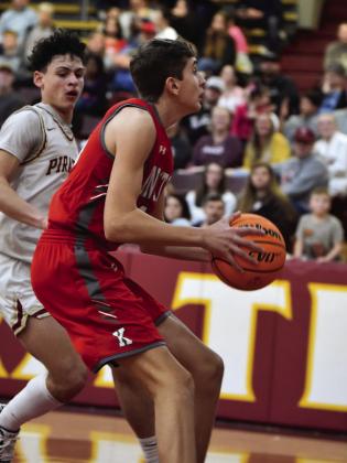 Hayden Seeney prepares to shoot during the Redskins v Pirates game.. Crockett Uber