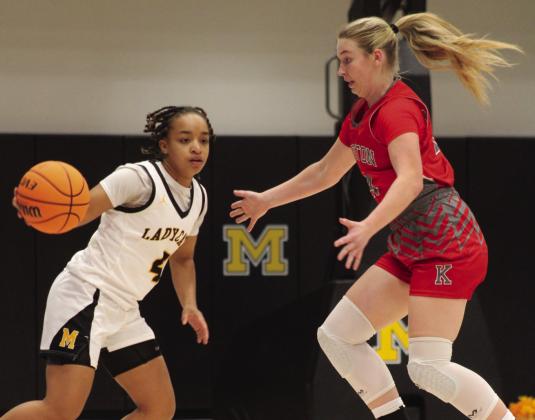 Lamiyah Brown, Madill, goes head to head with Destry Davis, Kingston. Summer Bryant