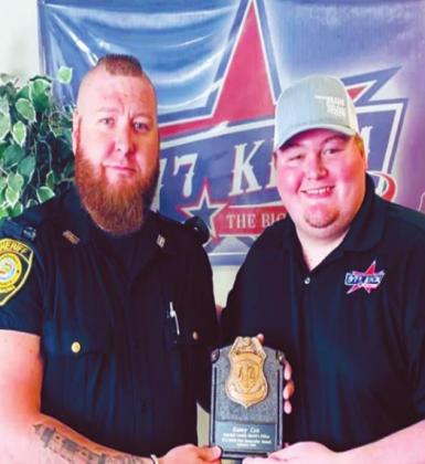 Marshall County Deputy Kasey Cox and KCIM DJ Bryson holding the First Responder Friday award. Cox was honored with being the first one from the Marshall County Sheriff’s Office to receive the award. Courtesy photo