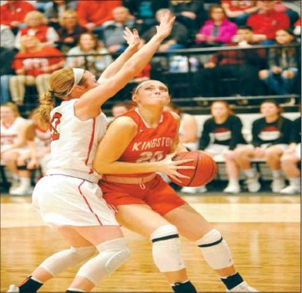 A Lady Redskin fights hard to pass the ball to a teammate. Courtesy photo
