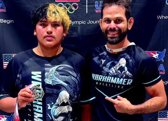 Alex Sarabia with his Silver Medal for Greco Roman, as he qualifies for Fargo in both Freestyle and Greco with Coach Peter Hammer.