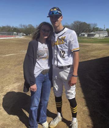 Cash Coble poses with a fan after a Wildcat baseball game. Courtesy photo