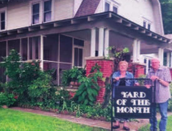 The Madill Rose Garden Club selected Dale and Sue Cherry to receive June Yard of the Month. Mature trees compliment this well-maintained yard on a corner lot. Border pavers enclose various green plants with include garlic and an Oklahoma native Poke plant. A Grecian urn enhances the colorful tree ring. Mary Jane Lowery