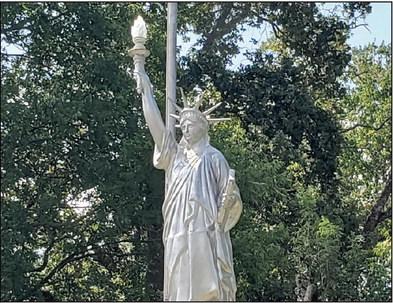 Sambo Eppler has a 15-foot Statue of Liberty replica in his front yard. Burnezky-Robertson