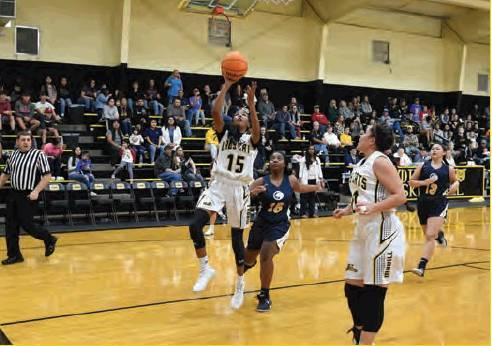 Dibbon Marris • For the Madill Record Madill junior Jocelyn Stumblingbear shoots from close range during the Lady Wildcats’ 58-4 win over the Putnam Heights Lady Panthers Dec. 5 at the Madill Winter Classic.