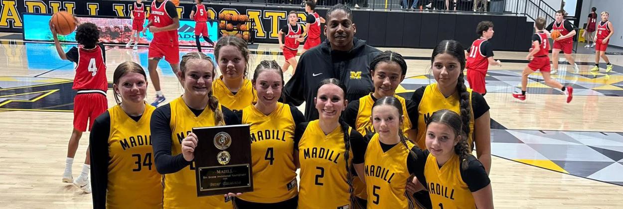 8th grade basketballers claim tourney titles