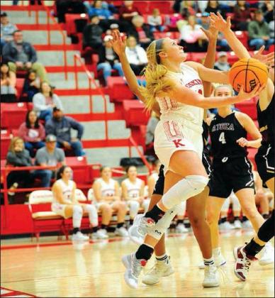 Crockett Uber • For The Madill Record Kingston girls basketball player Britt Henderson shoots through a group of Atoka defenders in the 2020 New Year’s Classic Girls Consolation Game Jan. 11. The Lady Redskins won 65-29.