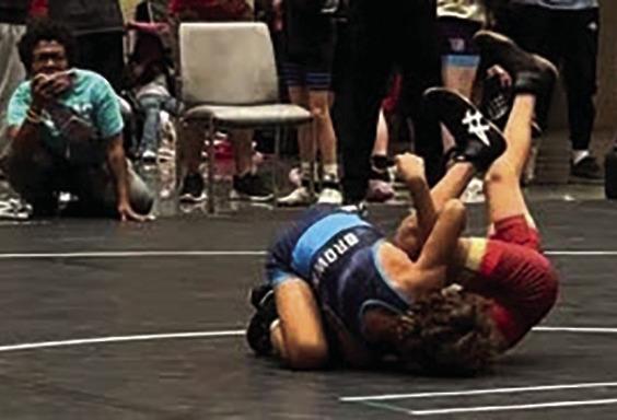 Left: Bowen Brown executing a cradle for a pin; just one of his many 1st-round pins. Right: Bowen Brown with his Gold Medal atop the podium Courtesy photos