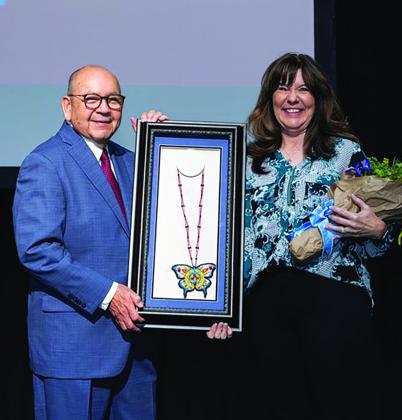 Chickasaw Nation Governor Bill Anoatubby presents Nancy Howell with the 2023 Chickasaw Nation Dynamic Woman of the Year Award during the annual Chickasaw Nation Dynamic Women Conference, conducted June 1-2 at WinStar World Casino and Resort. Courtesy photo