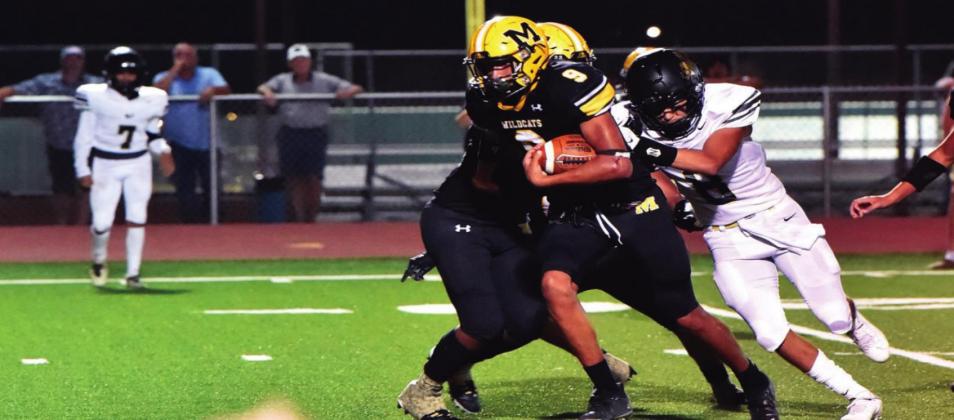 Yovanny (Yoyo) Robles breaks through a Marietta Indians defensive line. The Madill Wildcats beat Marietta 51-0. Crockett Uber