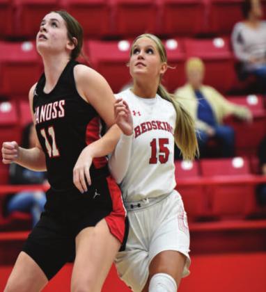 Ethel Stewart battles her opponent for a spot on the court during the Redskins v Vanoss game. Crockett Uber